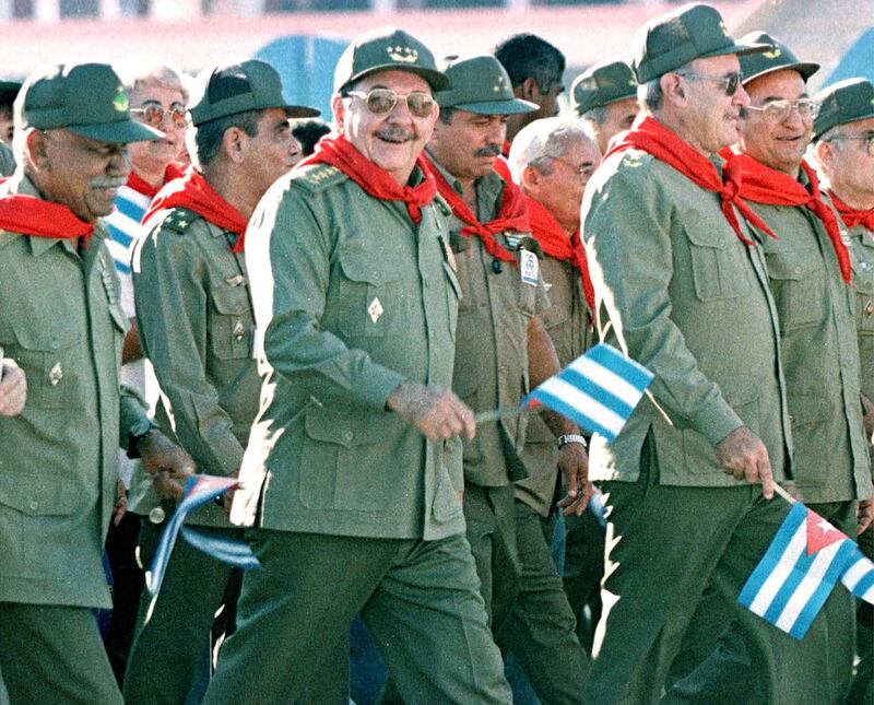 Cuban Armed Forces Minister Raul Castro (C) joins protesters as they march past the U.S. Interests Section in Havana, July 26, 2000. President Fidel Castro led a group of Cubans as they commemorated the date of the Moncada barracks battle of July 26, 1953 in Santiago de Cuba, where Castro-led revolutionaries fought a historic battle against then-dictator Fulgencio Batista. Raul castro is the brother of Fidel.

RP/HB