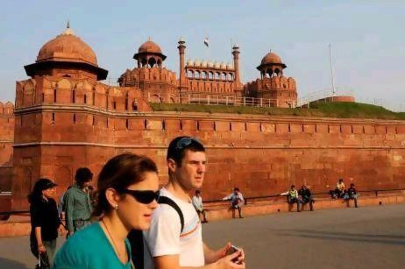 Tourists leave the historic Red Fort, which dates back to 1639 and is also a UNESCO World Heritage Site, in New Delhi. Anna Zieminski / AFP