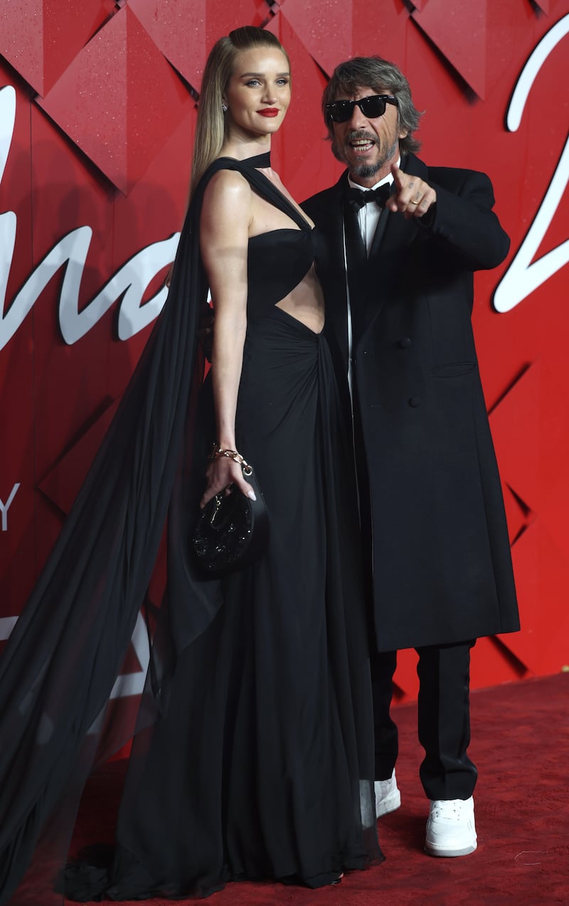 Model Rosie Huntington-Whiteley with Valentino creative director Pierpaolo Piccioli. Getty Images