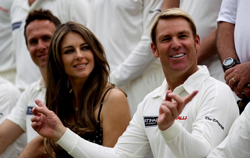 Shane Warne and Elizabeth Hurley before Shane Warne's Australia took on Michael Vaughan's England in a T20 match at Cirencester Cricket Club in 2013. Getty Images