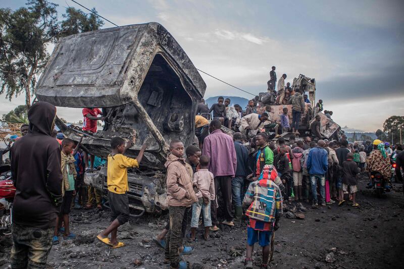 Residents dismantle a vehicle belonging to the UN Stabilisation Mission in the Democratic Republic of the Congo (Monusco) in Kanyaruchinya, Nyiragongo territory, after it was set on fire overnight by angry locals. AFP