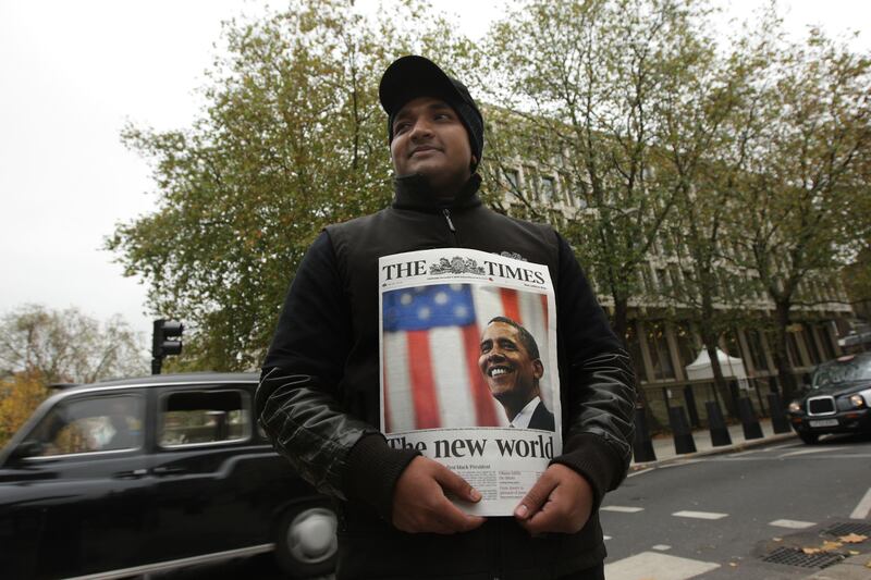 A newspaper vendor outside the embassy selling The Times featuring Barack Obama on the cover after he was elected US President in November 2008. Getty Images