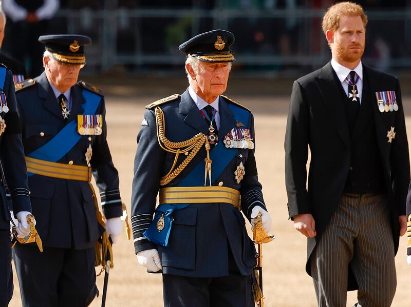 King Charles III and Prince Harry walk behind the coffin of his mother, Queen Elizabeth II, at her state funeral. Getty