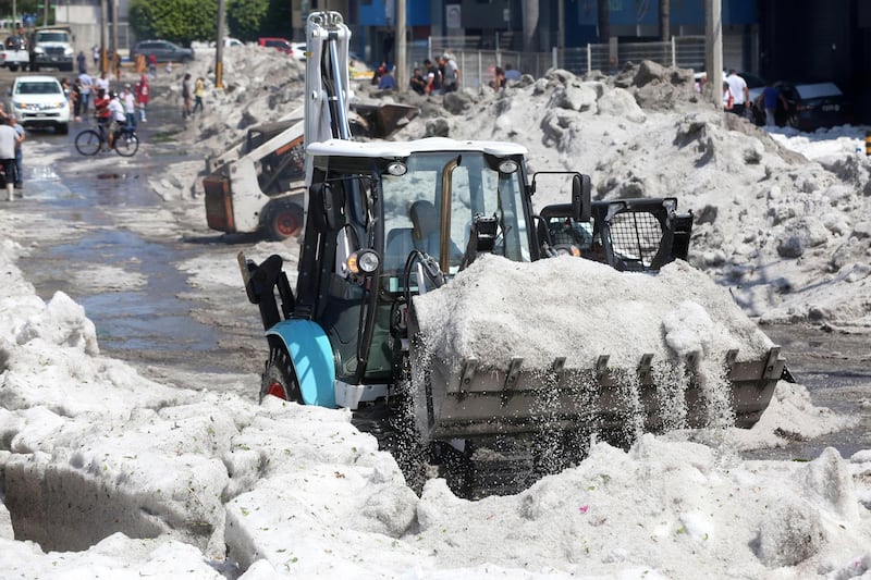 A truck carries ice as it cleans the street after a heavy storm of rain and hail which affected Guadalajara, Mexico. Reuters