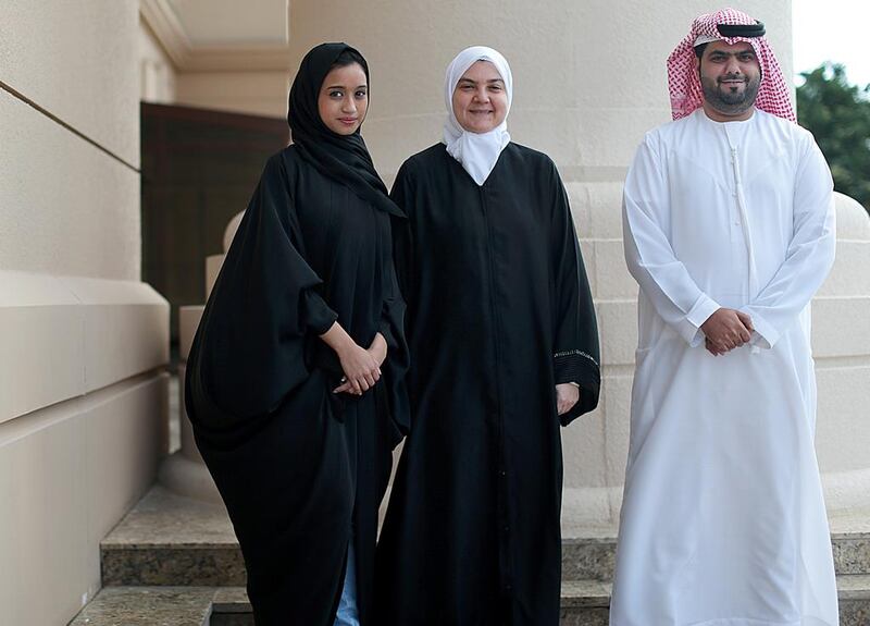 Ibrahim bin Madhi, 25, right, a mechanical engineer student and Radhya Mohamed, 22, left, a finance student, with Rima Shaban, the manager of the Innovation and Entrepreneurship Center at Abu Dhabi University. Christopher Pike / The National