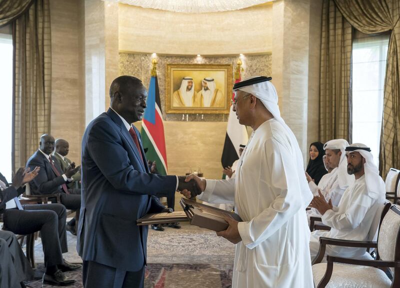 ABU DHABI, UNITED ARAB EMIRATES - April 23, 2019: HE Obaid Humaid Al Tayer, UAE Minister of State for Financial Affairs (R), exchanges an MOU with a South Sudanese counterpart during an MOU signing ceremony at Al Shati Palace.  

( Mohamed Al Hammadi / Ministry of Presidential Affairs )
---
