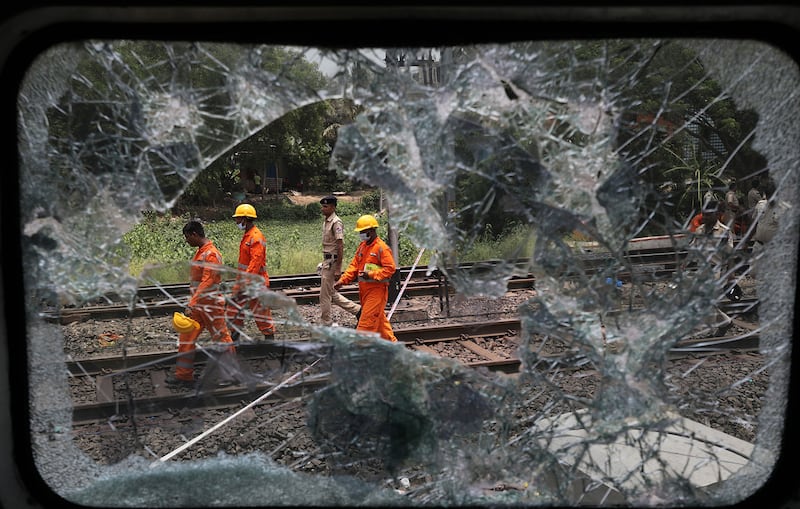 Over 200 people died and more than 900 were injured after three trains collided one after another.  EPA