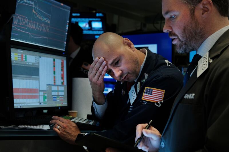 NEW YORK, NEW YORK - AUGUST 14: Traders work on the floor of the New York Stock Exchange (NYSE) on August 14, 2019 in New York City. Following news of an economic slowdown in both Germany and China, concerns over a recession in America have sent stocks plummeting with the Dow down over 800 points.   Spencer Platt/Getty Images/AFP
== FOR NEWSPAPERS, INTERNET, TELCOS & TELEVISION USE ONLY ==
