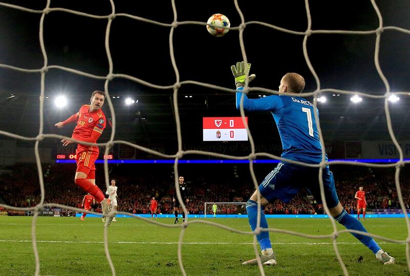 Wales midfielder Aaron Ramsey scores their first goal. AP