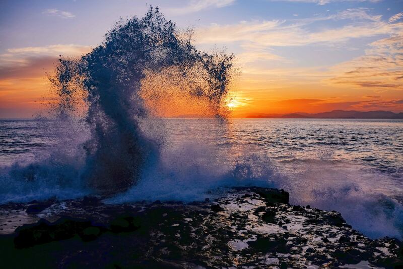 Waves hit a mangrove swamp at sunset in Bajamar, Costa Rica. EPA

