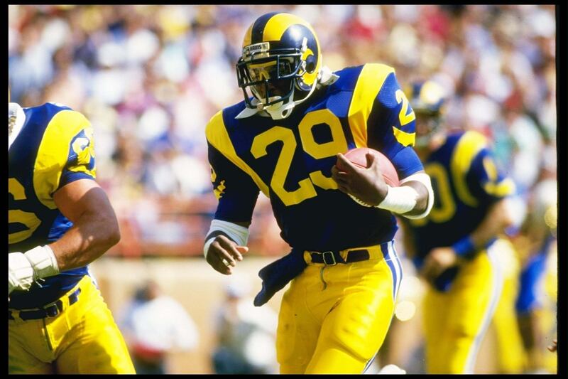 19 Oct 1986:  Running back Eric Dickerson of the Los Angeles Rams moves the ball during a game against the Detroit Lions at Anaheim Stadium in Anaheim, California.  The Rams won the game, 14-10. Mandatory Credit: Mike Powell  /Allsport / Getty Images