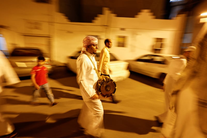 A musaharati drummer wakes people for suhour in Manama, Bahrain.  Reuters