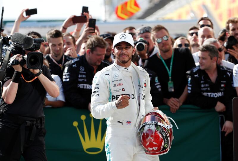 Hamilton celebrates with his team. Reuters