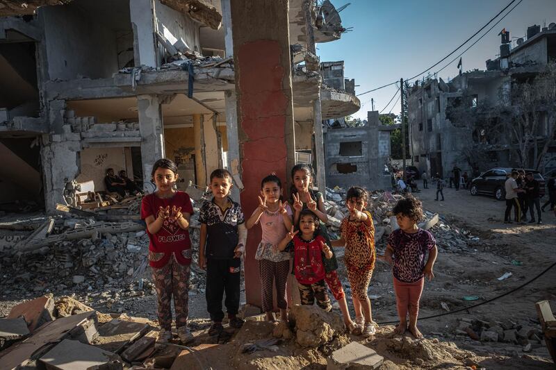 Palestinian children resume life amid the rubble of destroyed homes in Beit Hanoun, Gaza. Getty