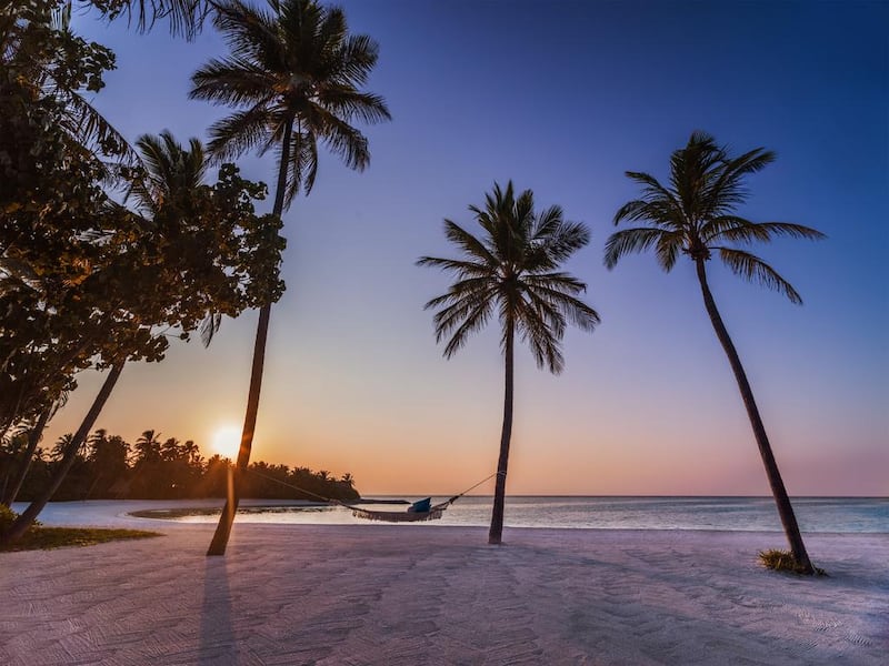 Guests at One & Only Reethi Rah can relax in a hammock and gaze out into the blue-green waters of the ocean. Coutesy One&Only Reethi Rah