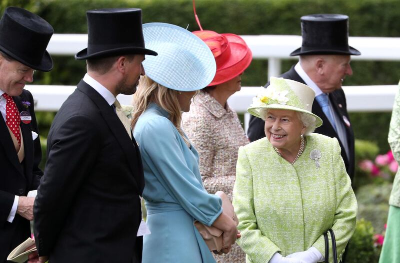 Queen Elizabeth II , Autumn Phillips, centre, and Peter Phillips at Ascot Racecourse. Jonathan Brady / PA Wire