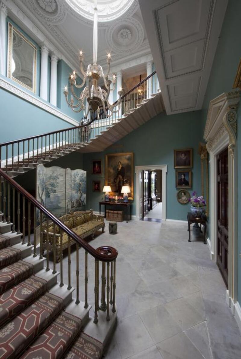 The Stair Hall with its cantilevered stair and hung with Coote family portraits at the Ballyfin. Courtesy Ballyfin