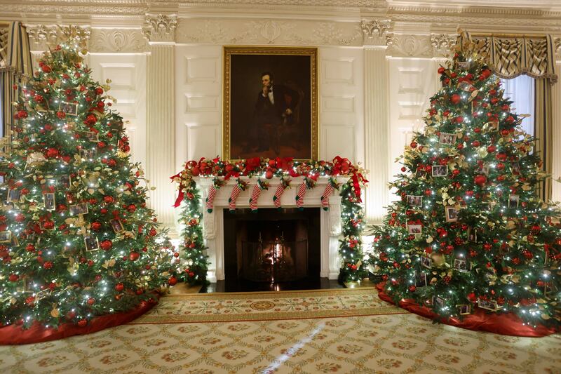 Christmas trees in the State Dining Room are decorated with snapshots of US  presidents and their families. Reuters