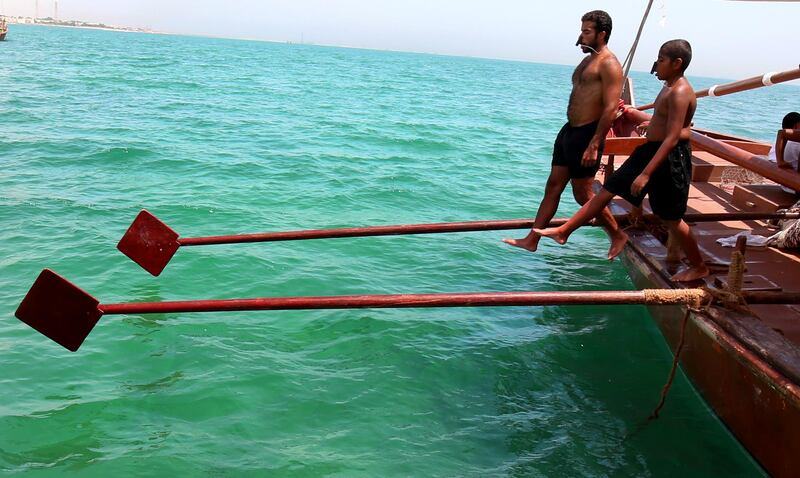 Kuwaiti divers jump in the warm August waters of the Arabian Gulf to look for pearls. All photos by Yasser Al Zayyat / AFP Photo