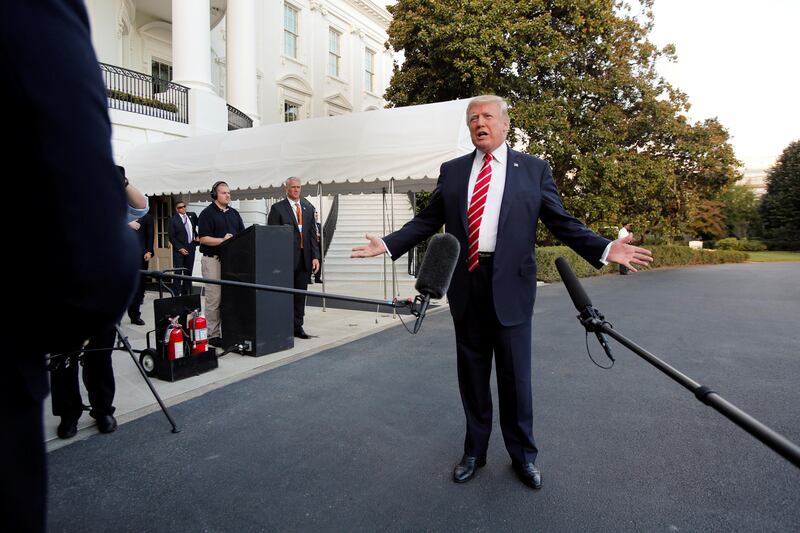 U.S. President Donald Trump talks to the media on South Lawn of the White House in Washington before his departure to Greensboro, North Carolina, U.S., October 7, 2017. REUTERS/Yuri Gripas