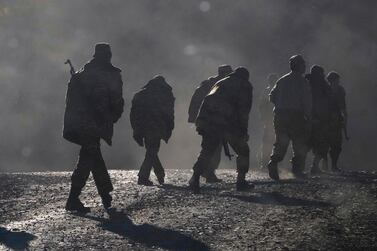 Ethnic Armenian soldiers walk along the road near the border between Nagorno-Karabakh and Armenia. AP
