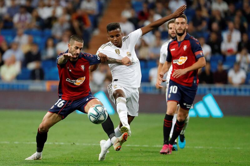Real Madrid's Rodrygo in action against Osasuna's defender Lillo. EPA