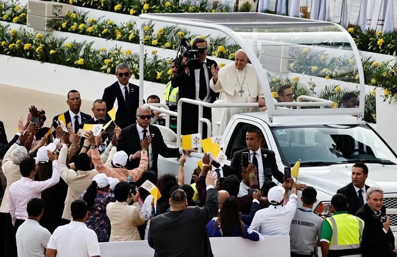 Pope Francis greets people as he attends a holy mass at Bahrain National Stadium during his apostolic journey, in Riffa, Bahrain. Reuters