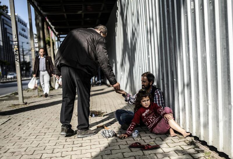 Syrian refugees in Istanbul. Human rights campaigners and the European Union are likely to welcome Ankara's move to grant work permits to refugees, most of whom are working illegally and for minimal wages. Bulent Kilic/AFP