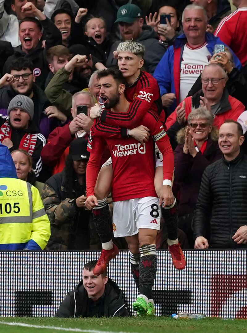 Manchester United's Bruno Fernandes celebrates with Alejandro Garnacho after scoring their first goal. PA 