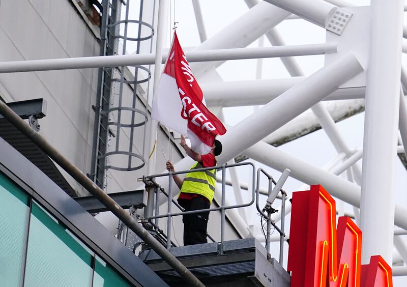 Flags are lowered at Old Trafford prior to the Europa League match between Manchester United and Real Sociedad. PA