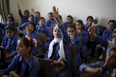 Pupils at a school in Irbid, Jordan. Many teachers in the country earn meagre salaries. Reuters