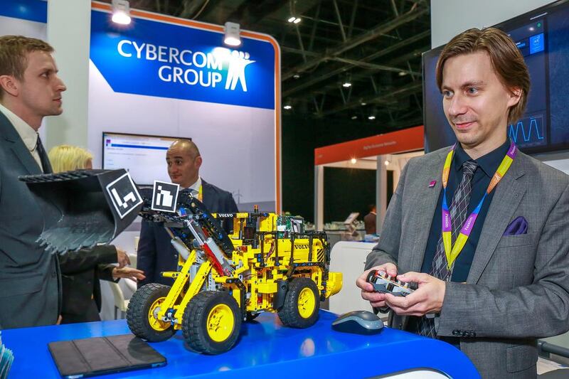 Cybercome Group demonstrates their connected vehicle-equipment remote monitoring device. Victor Besa for The National