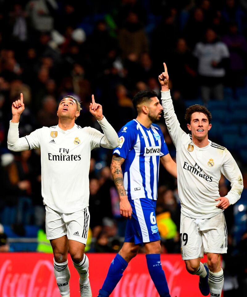 Mariano, left, celebrates his goal with Real Madrid's Spanish defender Alvaro Odriozola. AFP