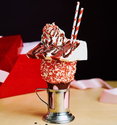 Black Tap's Valentine's Day CrazyShake features a slice of Magnolia Bakery cake on top. Photo: Black Tap