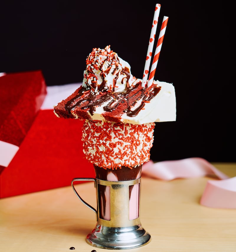 Black Tap's Valentine's Day CrazyShake features a slice of Magnolia's cake on top. Photo: Black Tap