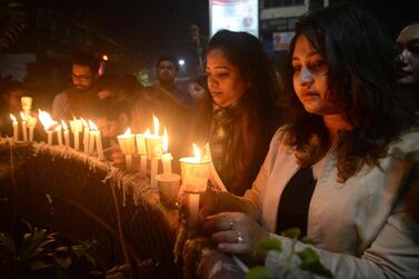 Indian mourners take part in candle light vigil as they pay homage to the killed service members in Siliguri on February 17, 2019, after an attack on a paramilitary Central Reserve Police Force (CRPF) convoy in the Lethpora area of Kashmir. India and Pakistan's troubled ties risked taking a dangerous new turn on February 15 as New Delhi accused Islamabad of harbouring militants behind one of the deadliest attacks in three decades of bloodshed in Indian-administered Kashmir. / AFP / Diptendu DUTTA