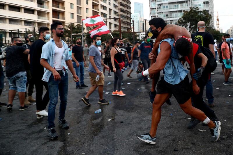 An injured demonstrator is evacuated during a protest. Reuters