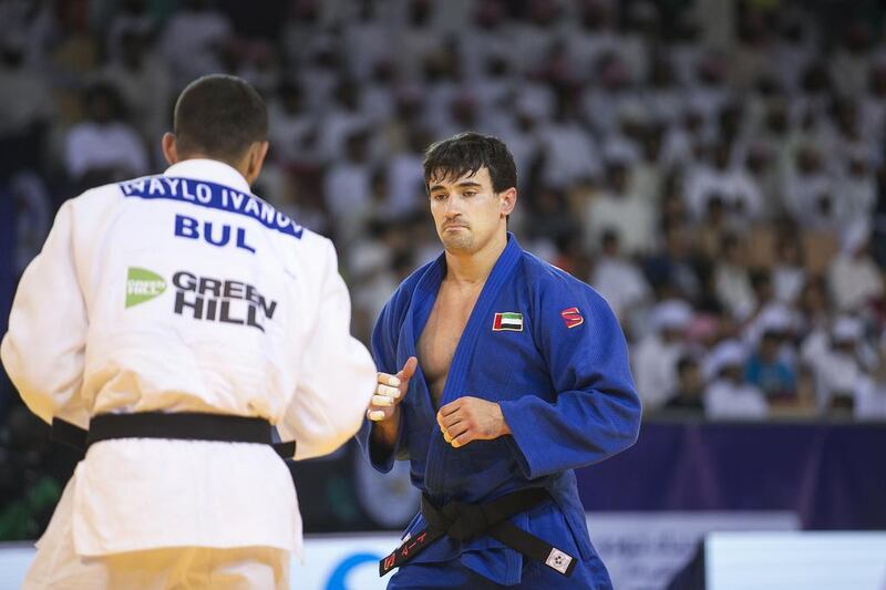 The UAE's Sergiu Toma, right, squares up during the 81-kg final at the Grand-Slam Judo Championship in Abu Dhabi, UAE. Mona Al Marzooqi/ The National