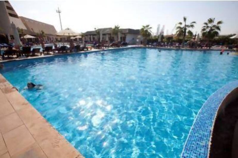 People enjoy the pool of the Radisson Blu Resort in Sharjah. Jaime Puebla/The National Newspaper