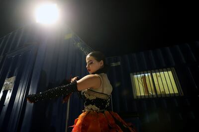 One of the performers gets her outfit ready ahead of showtime. Chris Whiteoak / The National