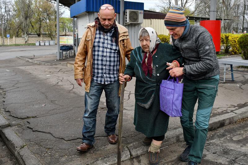 Maria Dyachenko, 83, is helped into a vehicle during the evacuation of civilians in Kramatorsk, Ukraine. AP