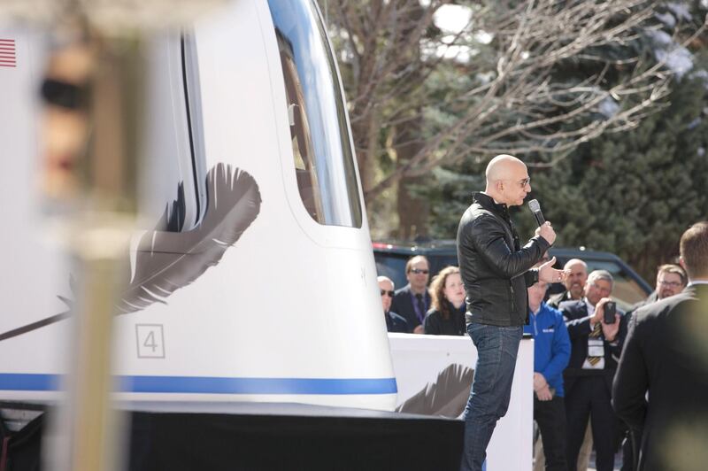 Jeff Bezos, chief executive officer of Amazon.com Inc. and founder of Blue Origin LLC, speaks at the unveiling of the Blue Origin New Shepard system during the Space Symposium in Colorado Springs, Colorado, U.S., on Wednesday, April 5, 2017. Bezos has been reinvesting money he made at Amazon since he started his space exploration company more than a decade ago, and has plans to launch paying tourists into space within two years. Photographer: Matthew Staver/Bloomberg