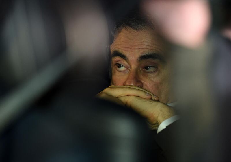 (FILES) This file photo taken on March 6, 2019 shows former Nissan chairman Carlos Ghosn leaving his lawyers' offices after he was released earlier in the day from a detention centre after posting bail in Tokyo. Carlos Ghosn's escape from Japan is "unjustifiable" and he is thought to have left the country using "illegal methods", the Japanese justice minister said on January 5, 2020, in the first official public comments on the case. / AFP / Kazuhiro NOGI
