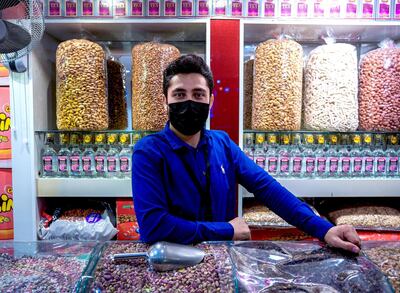 Abu Dhabi, United Arab Emirates, January 10, 2021.  Kalim, a nuts vendor at the Afghanistan market at Sheikh Zayed Festival.
Victor Besa/The National
Section:  NA
Reporter:  Saeed Saeed