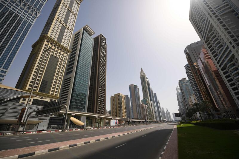 Dubai's Sheikh Zayed road is deserted during a curfew imposed by the authorities in a bid to slow down the spread of the novel coronavirus in the Emirati city on April 5, 2020.  Last night, Dubai, one of the seven emirates making up the UAE, announced a two-week lockdown in which it will carry out tests in densely populated areas. / AFP / KARIM SAHIB

