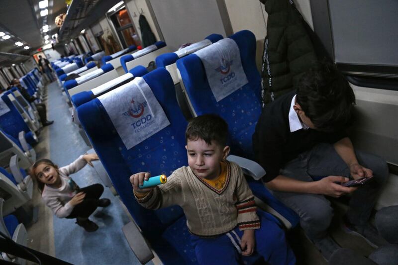 Children play in a train as they use it as shelter after an earthquake hit Elazig, Turkey. EPA