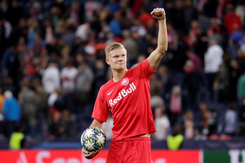 Erling Braut Haaland celebrates his hat-trick with the match ball. Reuters