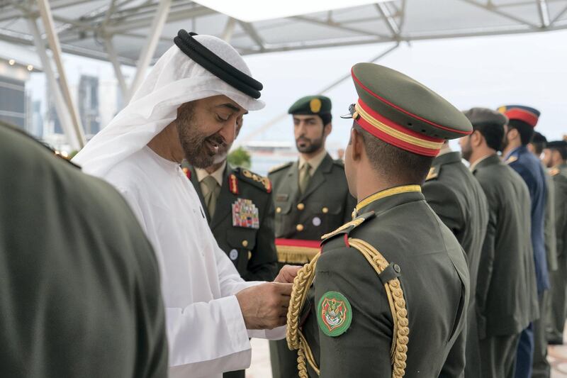 ABU DHABI, UNITED ARAB EMIRATES - November 12, 2018: HH Sheikh Mohamed bin Zayed Al Nahyan Crown Prince of Abu Dhabi Deputy Supreme Commander of the UAE Armed Forces (L), awards a members of the UAE Armed Forces with Medals of Bravery and Medals of Glory, during a Sea Palace barza.

( Rashed Al Mansoori / Ministry of Presidential Affairs )
---