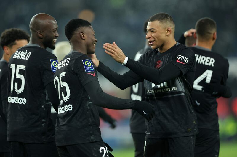 Paris Saint-Germain's Kylian Mbappe and Portuguese defender Nuno Mendes celebrate after Thilo Kehrer scored their second. AFP