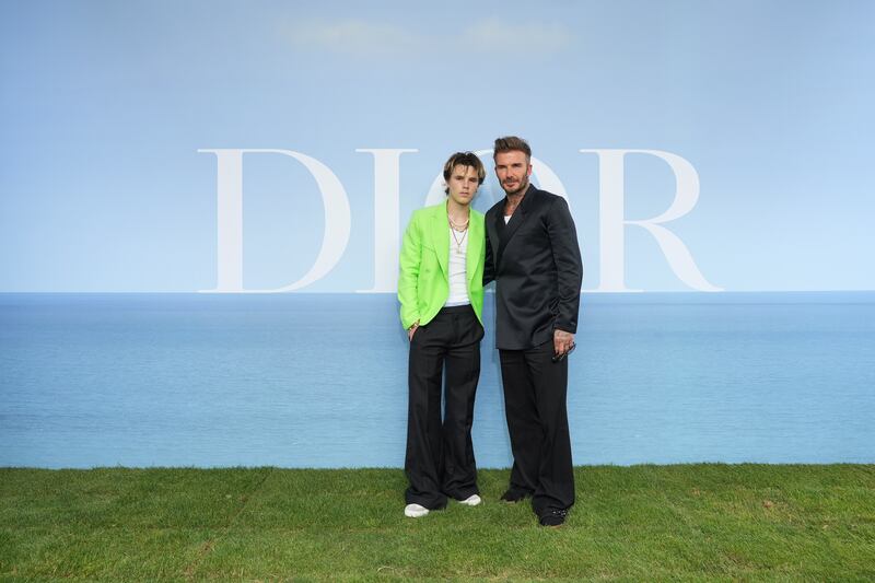 David Beckham, right, and son Cruz Beckham attend the Dior Homme photocall. Getty Images For Christian Dior